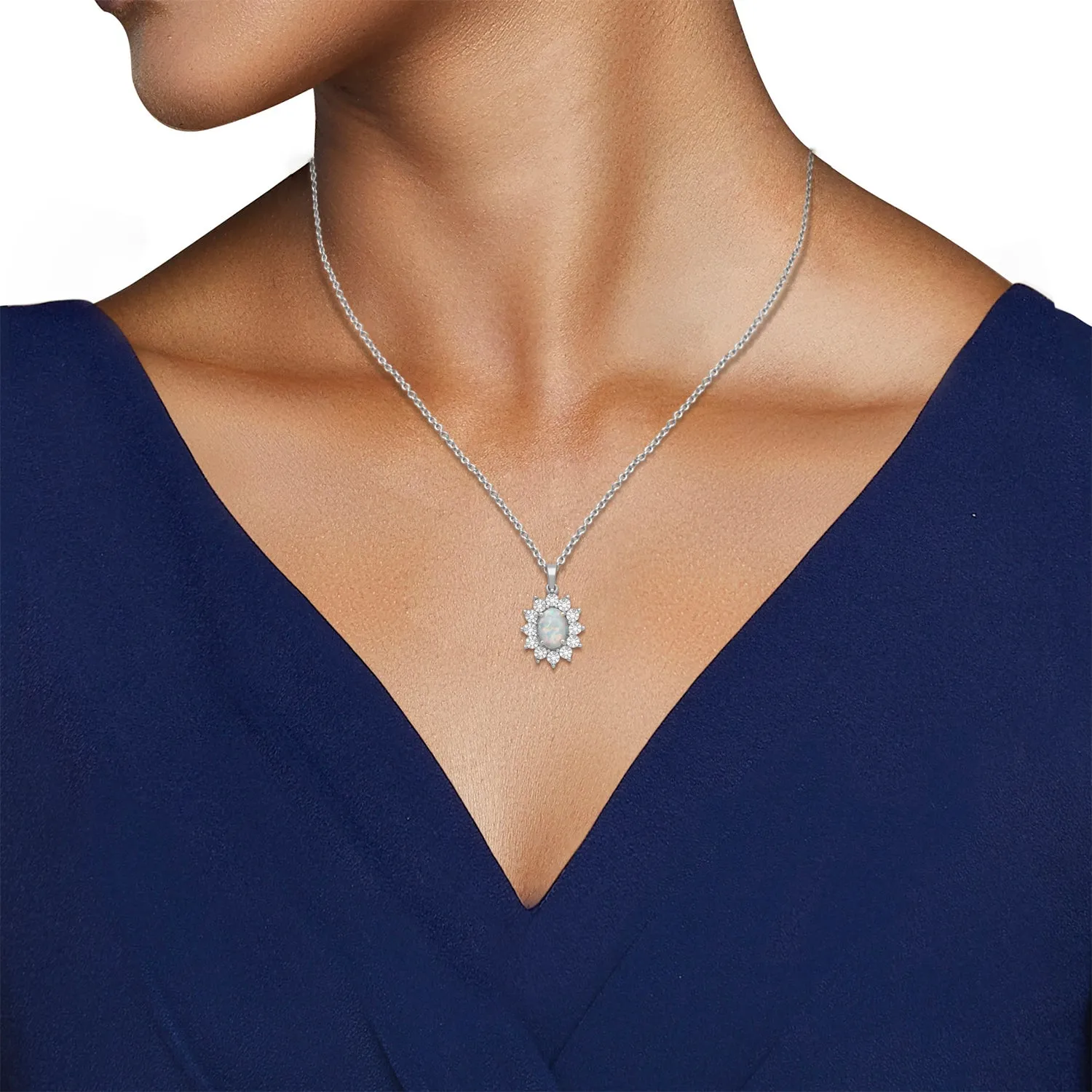 Jewelili Sterling Silver 7x5 MM Oval Cut Created Opal and 1/20 Cttw Natural White Round Diamond Halo Pendant Necklace
